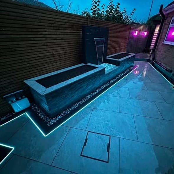 A porcelain garden lit with blue LED lights at night