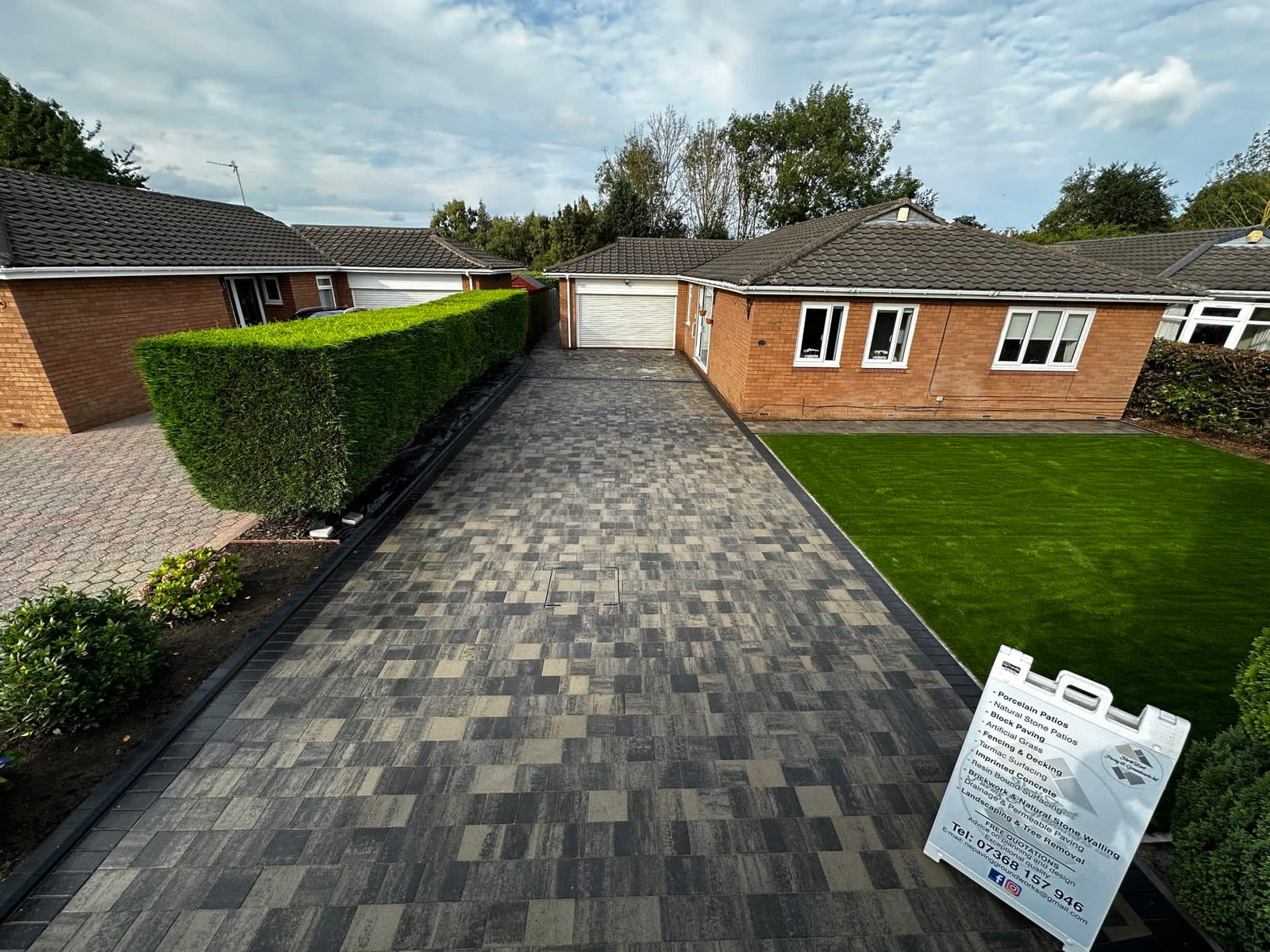 The front of a bungalow with a new driveway