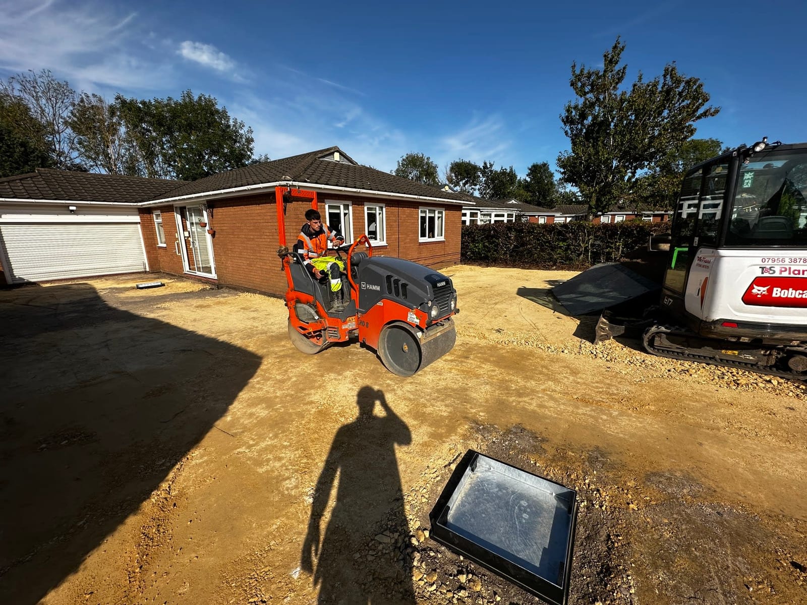 Groundworks in progress at the front of a bungalow with the sub-base laid