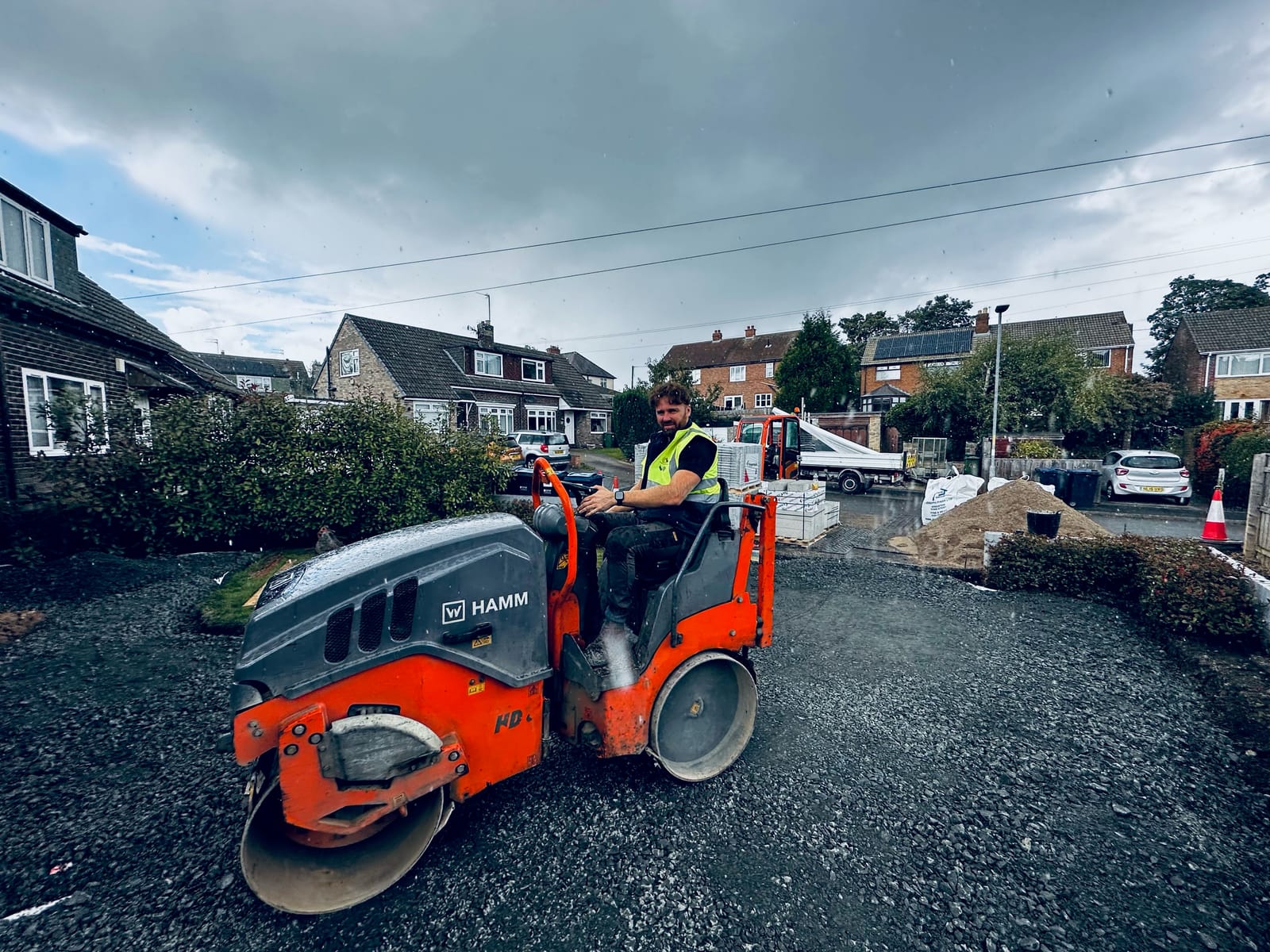 Compacting a new sub-base with a roller