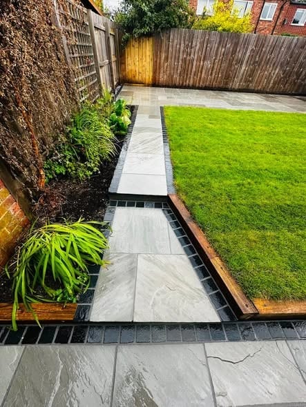 The porcelain path running beside the new lawn
